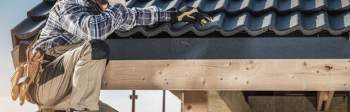 Roof Construction Worker Making Phone Call While Staying on Scaffolding.